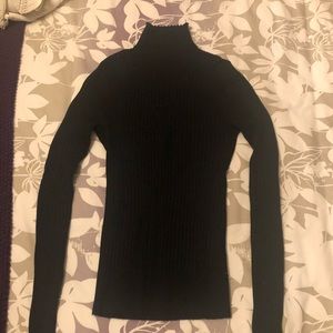 Black tight-fitted turtleneck